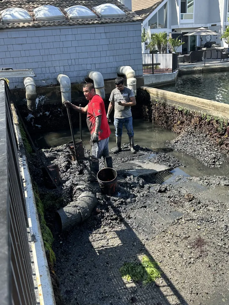 Barney Culls crew clearing sediment from a back-bay intake channel in Huntington Harbour